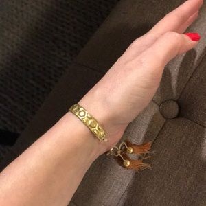 Honeycomb brass bracelet with golden tassels